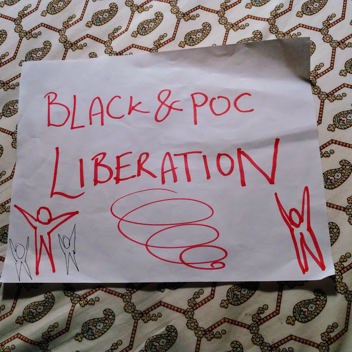 Sheet of paper that reads 'Black & POC Liberation' with drawings of star-people, arms up, and a large spiral